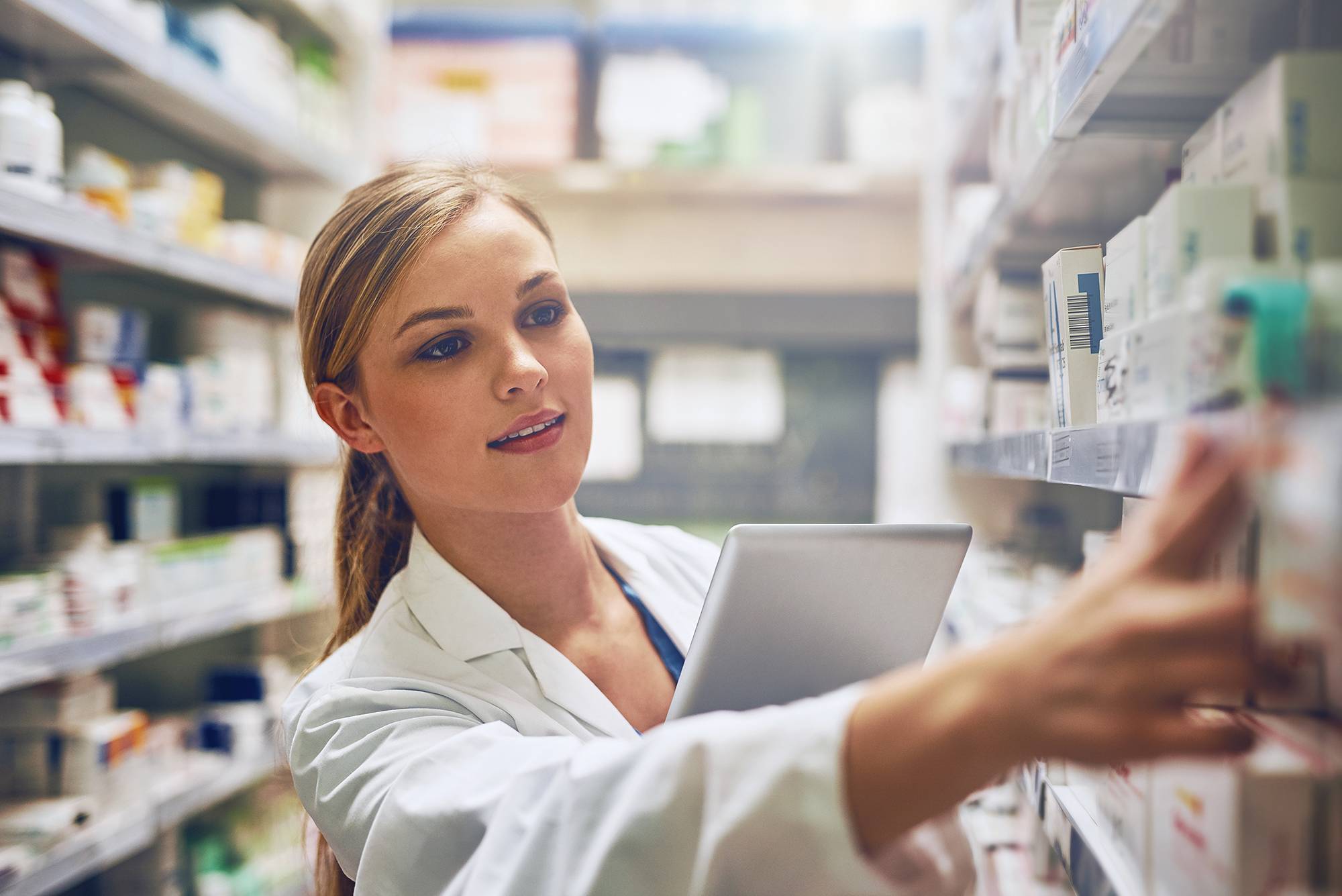 A pharmacist selecting medication